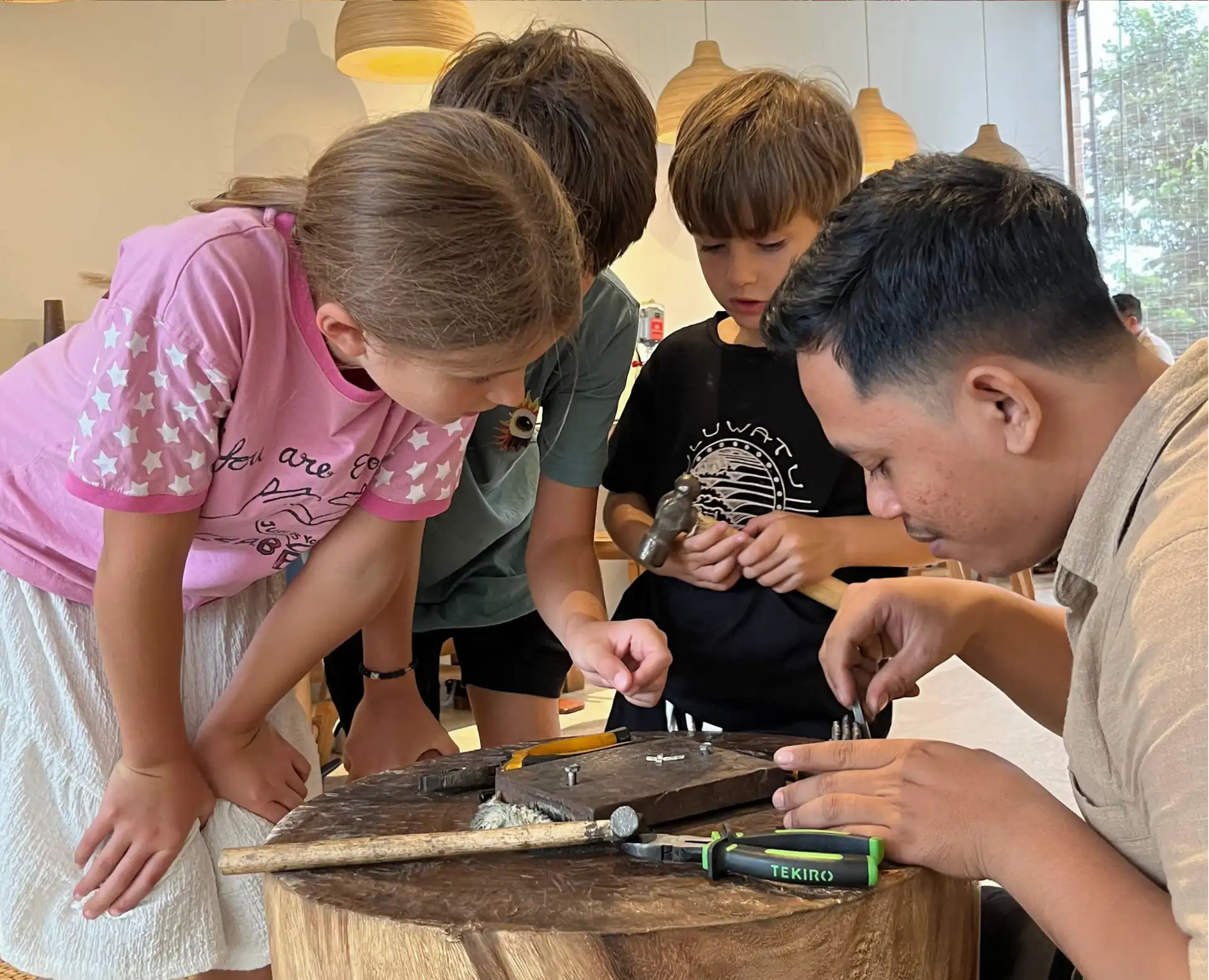 Uluwatu Silver Class - Seminyak Silver Class - Best Silver Class in Bali - 4 Children taking part in a silver jewelry workshop at Bingin Silver Class