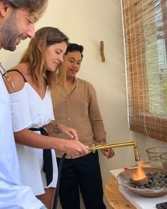 Artisan teaching silver melting techniques