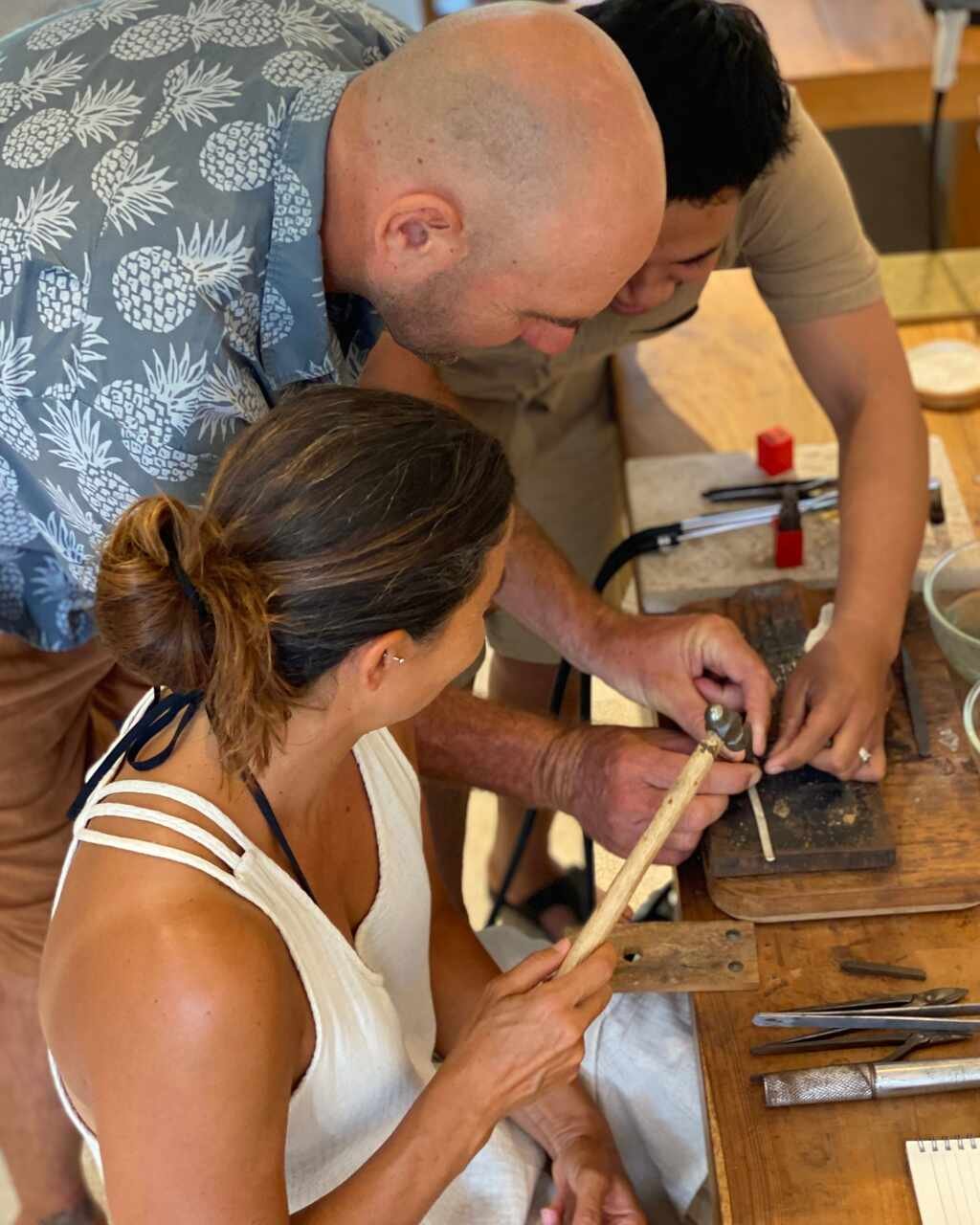 Guest receiving silver jewelry instructions