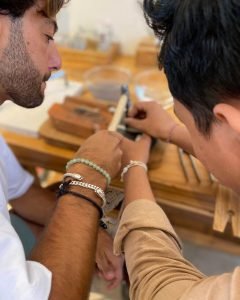 Beginner crafting her first ring with a guide