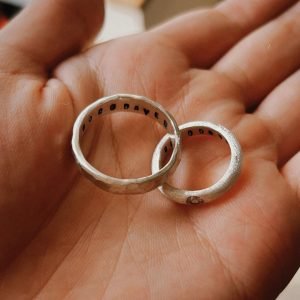 Two handcrafted silver rings with engraved details displayed on a hand, made at Bingin Silver Class an inspiring Jewelry Silver Class in Canggu for creating meaningful keepsakes.