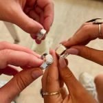 Group of friends showing off their handmade silver rings at Bingin Silver Class—one of the Best Activities to Do in Seminyak for a fun and creative experience.