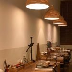 Interior of an Uluwatu silver class workshop, featuring tools, benches, and a cozy setting for hands-on jewelry making.