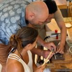 Guest receiving silver jewelry making instructions at Uluwatu silver class workshop.