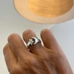 Close-up of a handmade silver ring with moon and star design, crafted at an Uluwatu silver class as a unique Balinese souvenir.