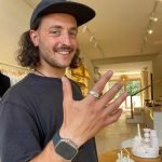 Smiling man showcasing a handmade silver ring created at an Uluwatu silver class, highlighting the personal experience of jewelry making.