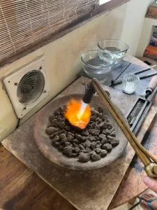 Mindful activities in Uluwatu at Bingin Silver Class, melting silver with fire during jewelry making workshop in Bali