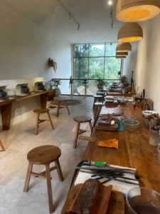 Bingin Silver Class jewelry workshop space in Bali with wooden tables, tools, and natural light studio