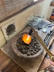 Bingin Silver Class in Bali - melting silver with torch during jewelry workshop
