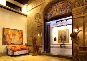 Interior of ARMA Museum in Ubud, Bali with traditional doorway and paintings.