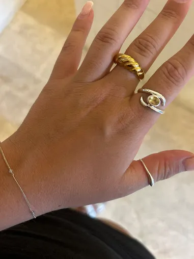 Participant showing handmade jewelry from Canggu Silver Class Bali experience.