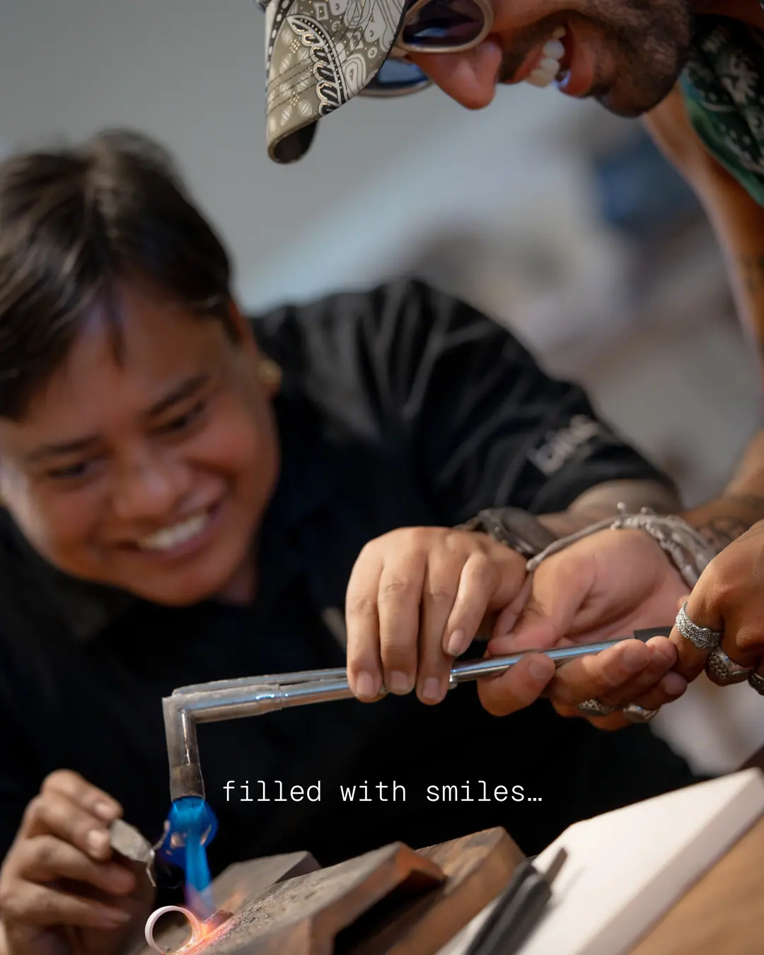 Smiling participants creating silver jewelry together during a hands-on workshop at Bingin Silver Class in Uluwatu, Bali